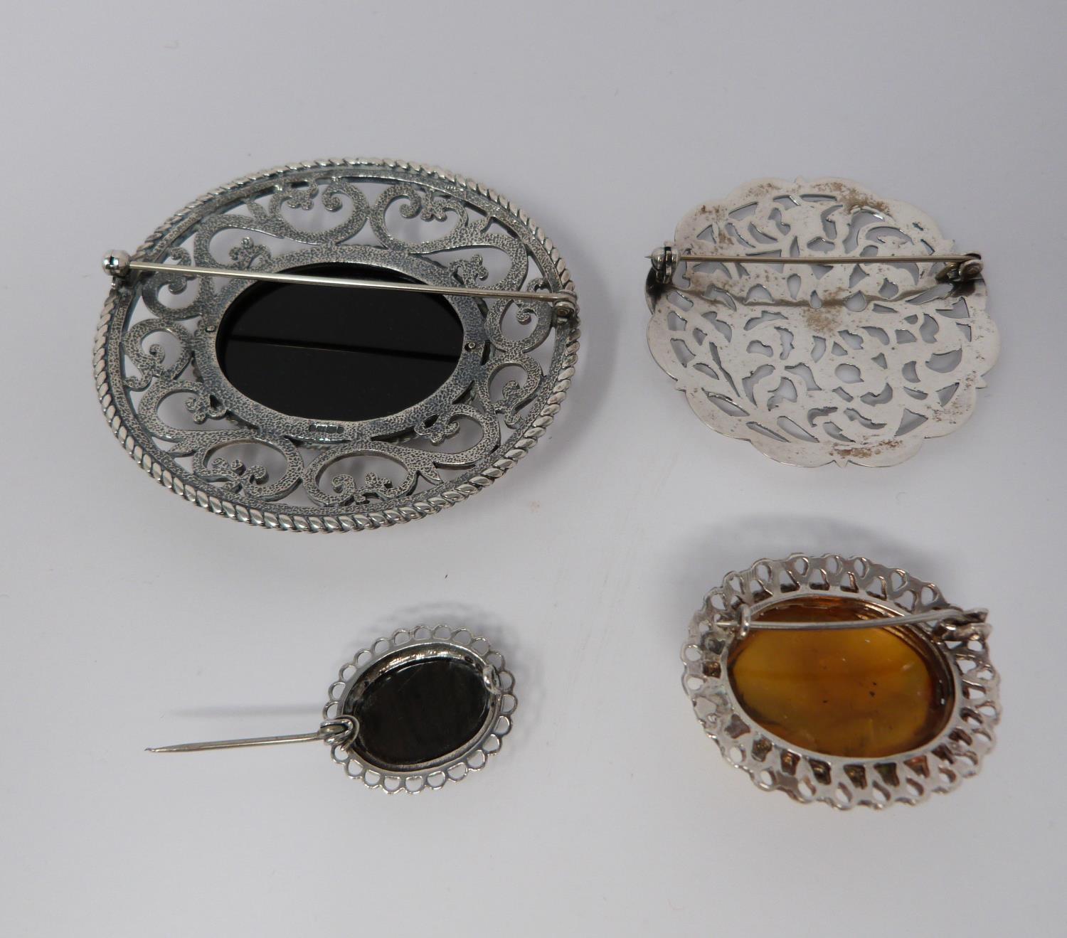 Large jet and hallmarked silver pierced brooch, with a pierced white metal brooch, small silver - Image 2 of 7