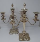 A pair of silver plated candelabra. Repoussé work, elegant swirled design, flame removable finial