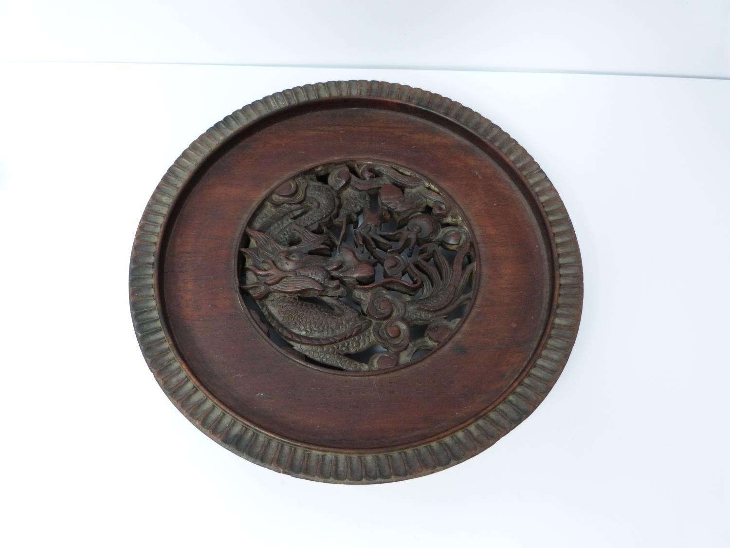 A Chinese 19th century hardwood pierced display stand, dragon motif with carved flower detailing - Image 2 of 5