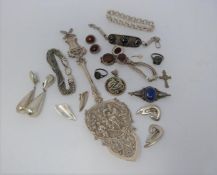 A mixed lot of silver and gold jewellery and a white metal spoon. (234g).