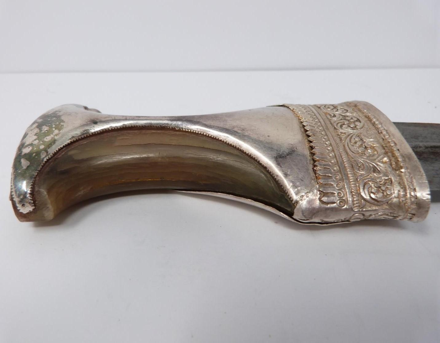 A 20th century silver Omani Khanjar with colourful and silver thread woven strap, covered with - Image 11 of 12