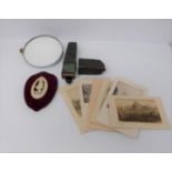 A set of signed etched postcards, bone carved plaque, shaving mirror and vintage razor in case