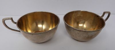 A pair of gilded silver Austrian punch cups, 1872, A city mark, makers mark JR. (169g).