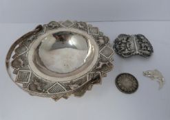 A white metal oriental handled dish, coin, silver fish pendant and white metal thai buckle, basket