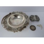 A white metal oriental handled dish, coin, silver fish pendant and white metal thai buckle, basket