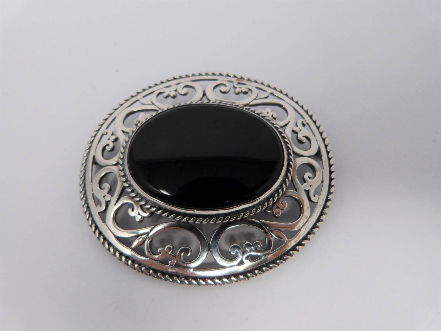 Large jet and hallmarked silver pierced brooch, with a pierced white metal brooch, small silver - Image 3 of 7