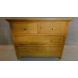 A contemporary oak chest of two short over two long drawers. H.93 W.116 D.48cm