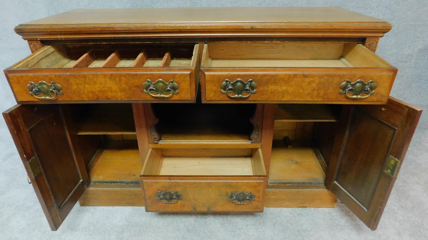 A late Victorian carved walnut sideboard fitted drawers and cupboards on bracket feet. H.94 W.137 - Image 2 of 8