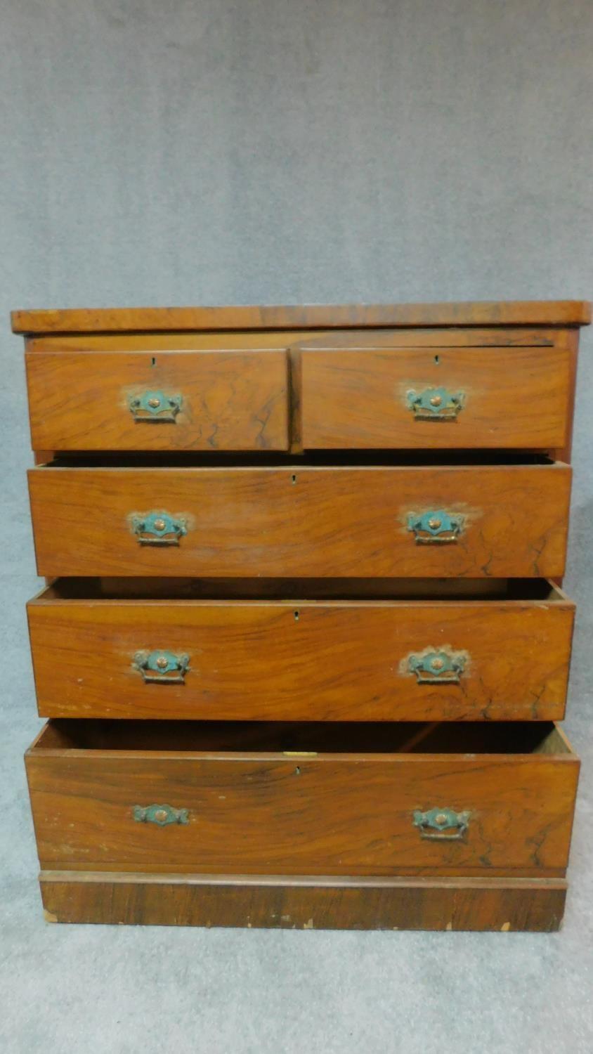 A Victorian walnut chest of 2 short over three long drawers fitted original brass handles. H.118 W. - Image 3 of 9