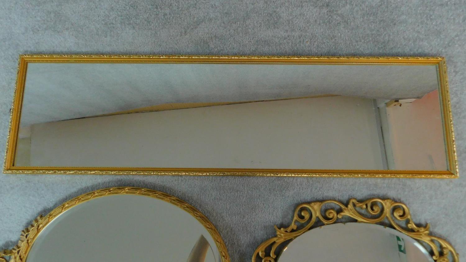 A rectangular gilt wall mirror and two oval gilt mirrors. 120x34cm - Image 4 of 5