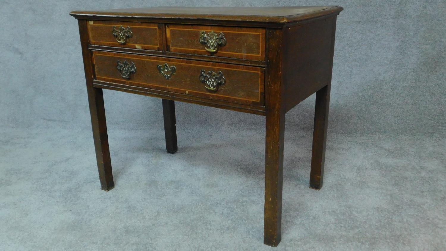 A Georgian country oak lowboy with mahogany crossbanding and satinwood stringing, two short over - Image 8 of 8