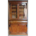 A mid Victorian mahogany two section library bookcase, the upper glazed section above well fitted