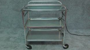 A vintage chrome framed butler's trolley on casters. H.79 W.77 D.45cm