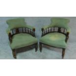 A pair of late 19th century carved and stained beech tub armchairs. H.77cm