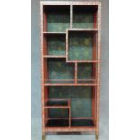 A Chinese red lacquered and mother of pearl inlaid open bookcase. H.166 W.71cm