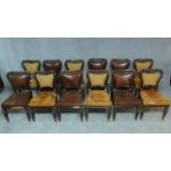 A set of twelve William IV mahogany dining chairs with carved shaped and leather upholstered backs