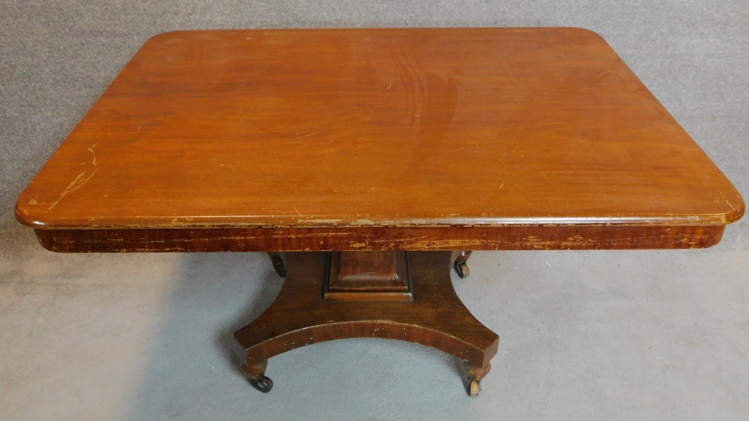 A Victorian mahogany tilt top breakfast table on platform base H.76 W.137 D.104cm