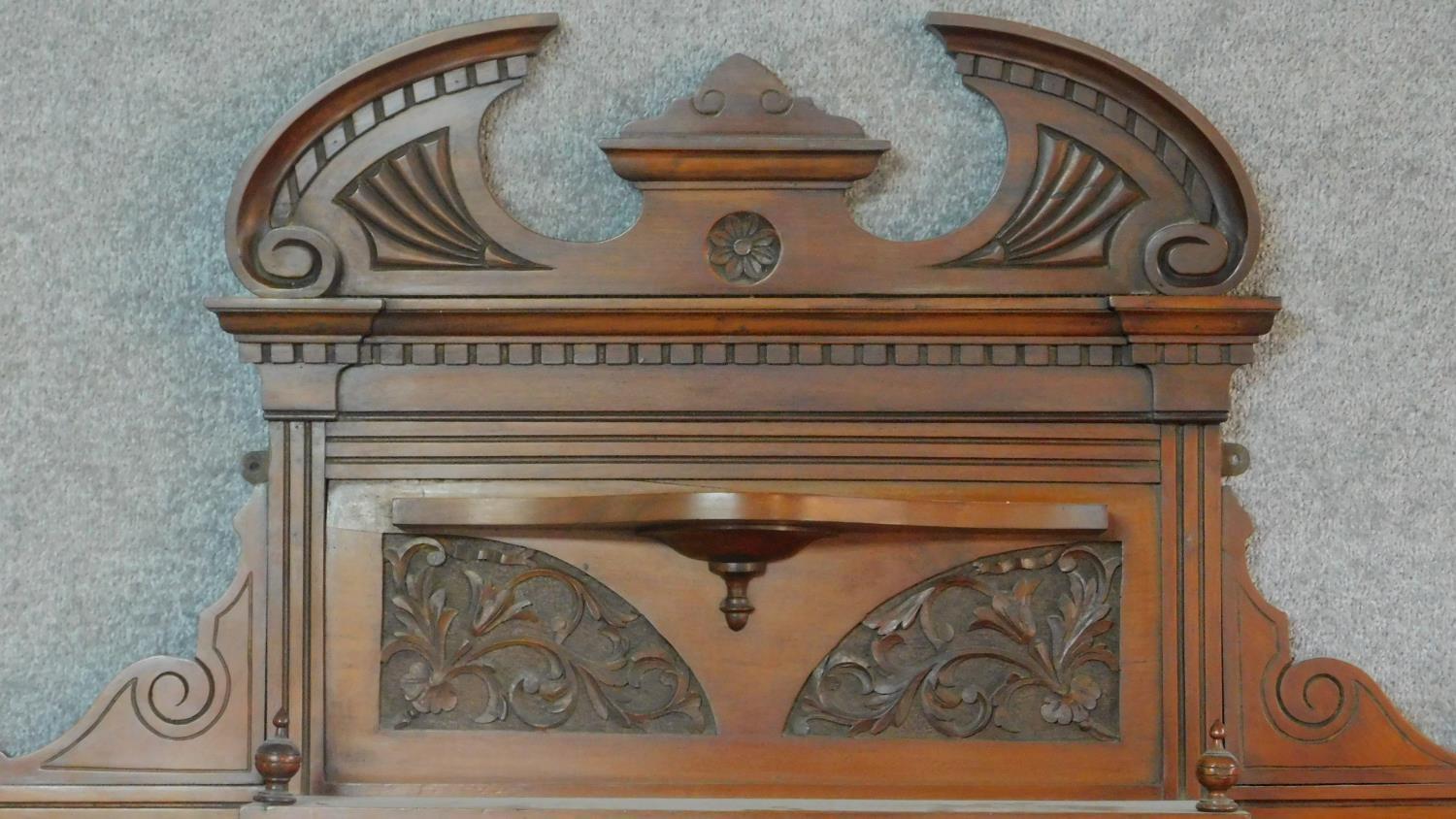 A Victorian carved walnut overmantel with broken arch pediment. H.135 W.111 D.16cm - Image 2 of 6