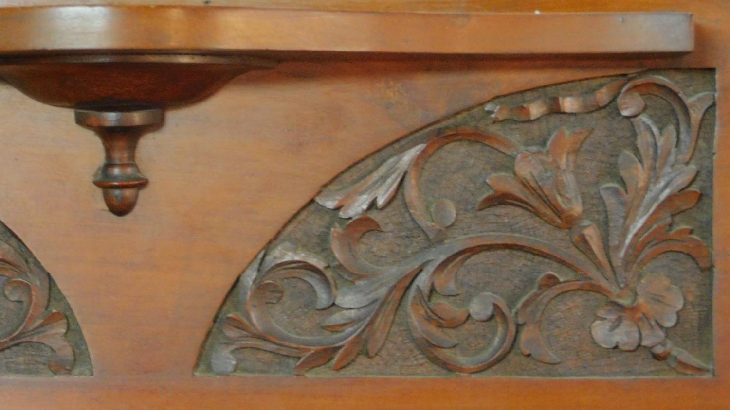 A Victorian carved walnut overmantel with broken arch pediment. H.135 W.111 D.16cm - Image 4 of 6