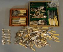 A large collection of miscellaneous silver plated and stainless steel flatware and cutlery