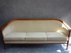 A mid 20th century Danish teak three seater sofa by Broderna Anderssons, makers label to