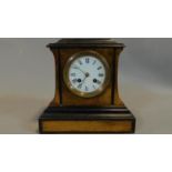 A 19th century walnut and ebonised mantel clock, circular enamel dial with Roman numerals with