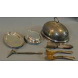 A silver plated meat dish cover, tureens, servers and a candle snuffer.