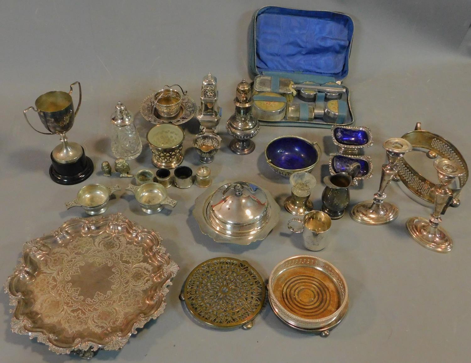 A miscellaneous collection of silver plated items, to include; pair candlesticks, embossed tray,