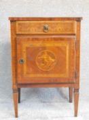 A 19th century continental walnut and marquetry inlaid pot cupboard with frieze drawer above