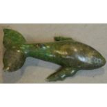A carved soapstone figure of a whale, inscribed. W.41cm (repair to one dorsal fin)
