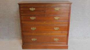 A late Victorian walnut chest of drawers fitted original brass handles on plinth base. 122x121x50cm