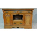 A late Victorian carved walnut sideboard fitted drawers and cupboards on bracket feet. H.94 W.137