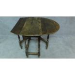 An antique country oak drop flap table. H.70cm (incomplete, for repair)