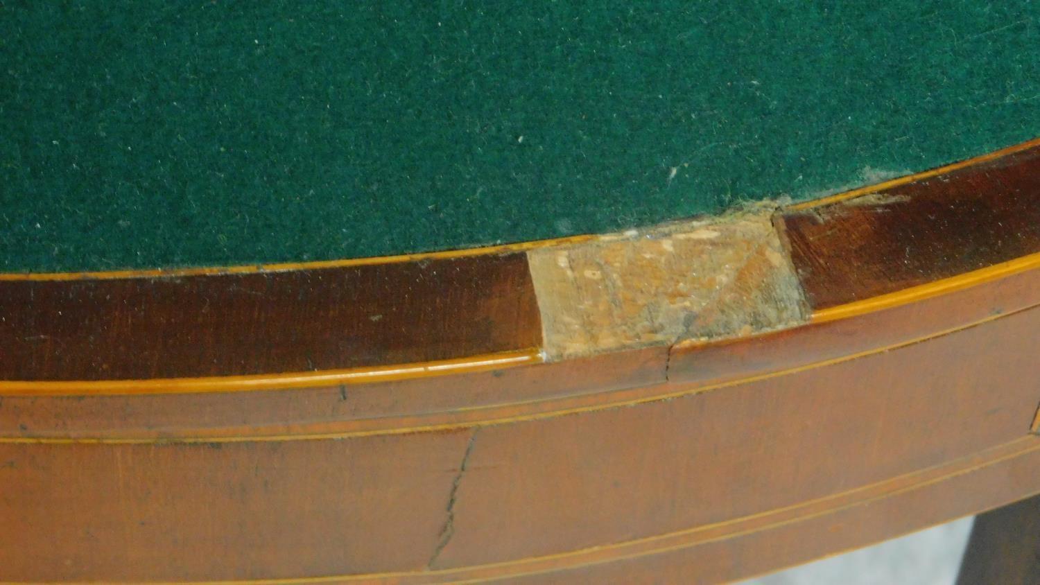 A Georgian mahogany and boxwood strung demi lune card table on square tapering supports. H.74 W.91 - Image 4 of 5