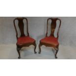 A pair of early Georgian style mahogany dining chairs with urn shaped splat, drop in seats on