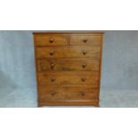 A Vicorian mahogany tall chest of drawers fitted two short over four long drawers with original knob