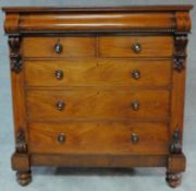 A Victorian mahogany chest fitted secret frieze drawer above two short and three long drawers with