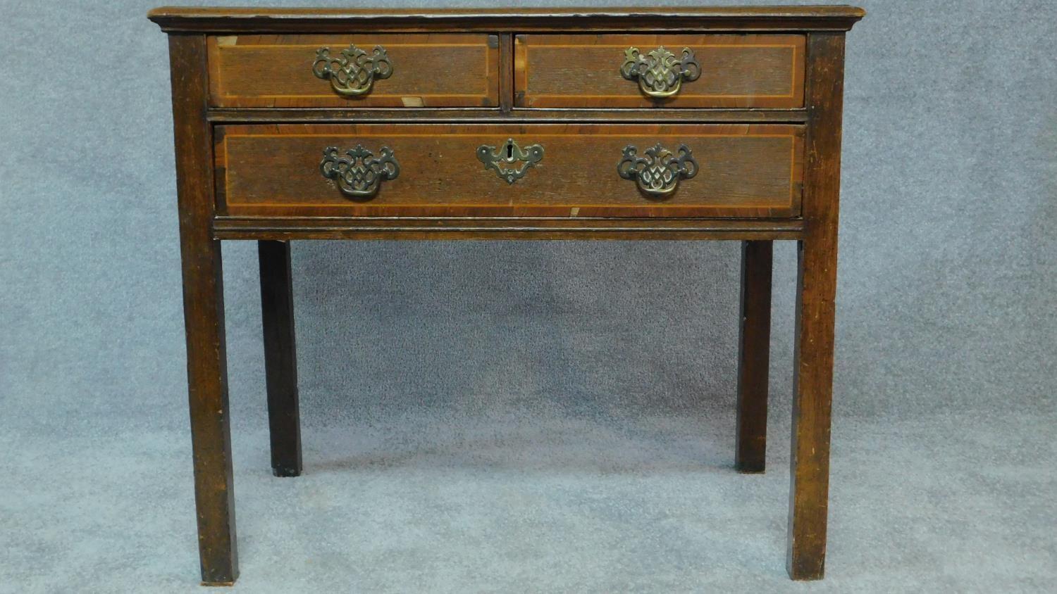 A Georgian country oak lowboy with mahogany crossbanding and satinwood stringing, two short over - Image 2 of 8