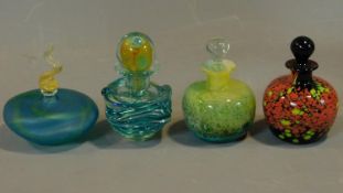 A collection of four coloured glass scent bottles. H.14 (tallest)