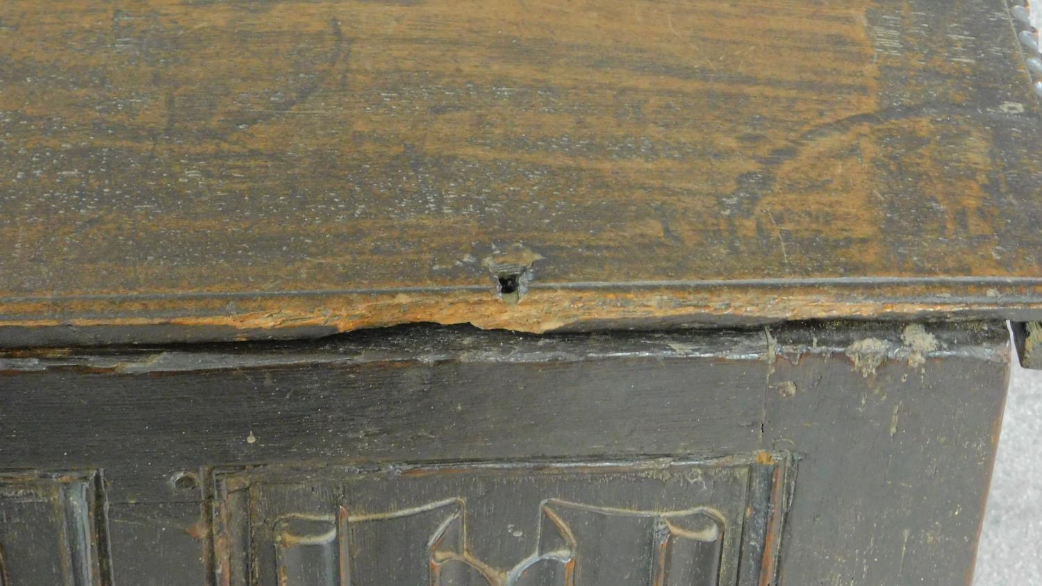 An early 17th century oak coffer with linenfold panels and hinged lidded top on block feet. H.62 W. - Image 9 of 10