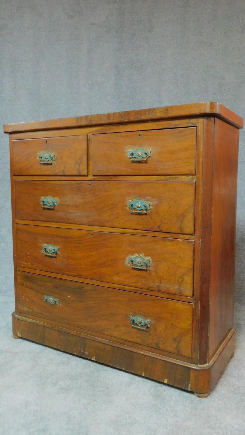 A Victorian walnut chest of 2 short over three long drawers fitted original brass handles. H.118 W. - Image 2 of 9