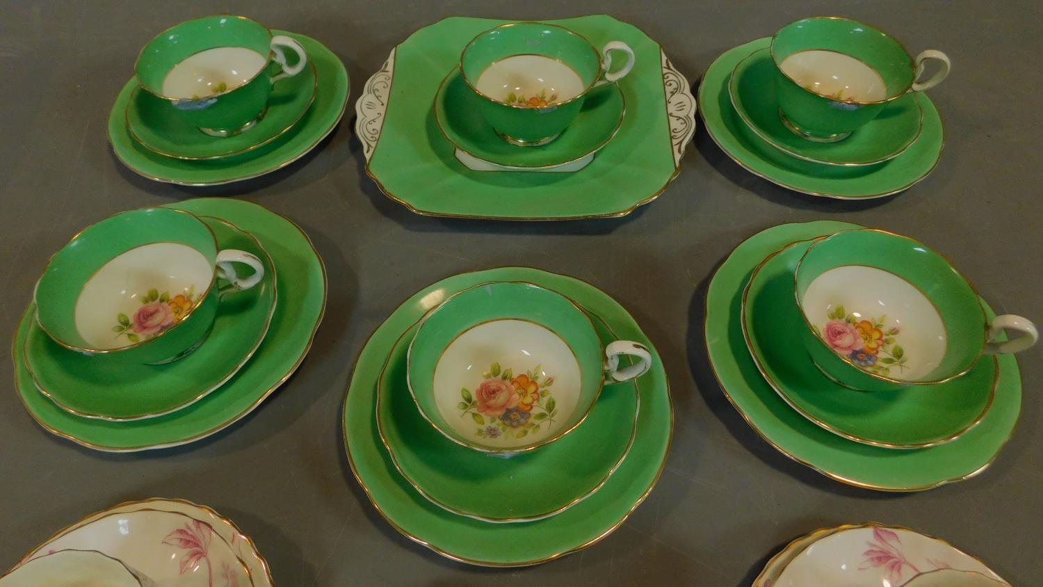 A green floral decorated tea set for six and a seven piece pink floral tea set. - Image 2 of 9