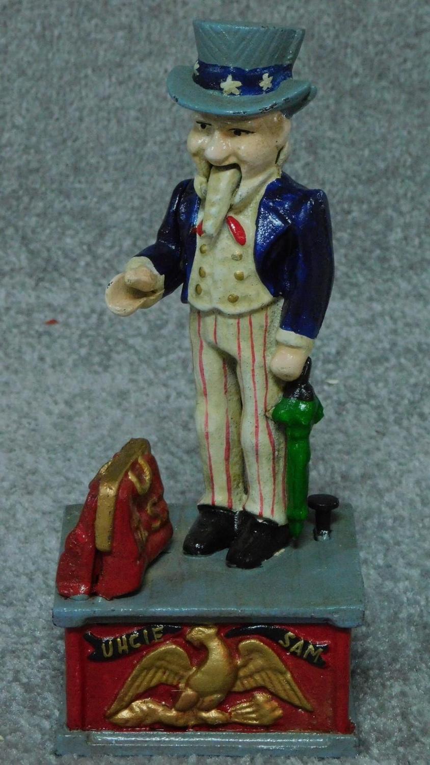 A painted metal Uncle Sam money box and another similar advertising Coca Cola. H.28cm - Image 3 of 3