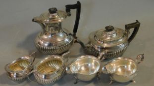 A four piece silver plated tea and coffee set and a pair of Elkington cream jugs. 23x19cm (largest)