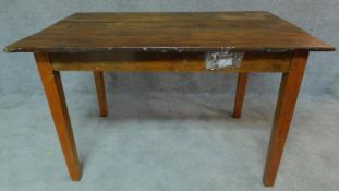 A country style planked top dining table on square tapering supports. H.78 W.127 D.81cm