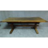 A 19th century oak Arts and Crafts refectory dining table on trestle base. H.72 W.217 D.106cm (