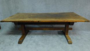 A 19th century oak Arts and Crafts refectory dining table on trestle base. H.72 W.217 D.106cm (