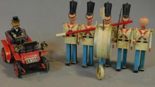 A toy model of a marching band and a tinplate vintage car. 21x25cm (car)