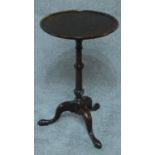 A 19th century mahogany wine table on tripod cabriole supports. H.65cm