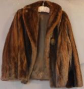 A medium size bespoke tailored mink fur coat. (good original condition)